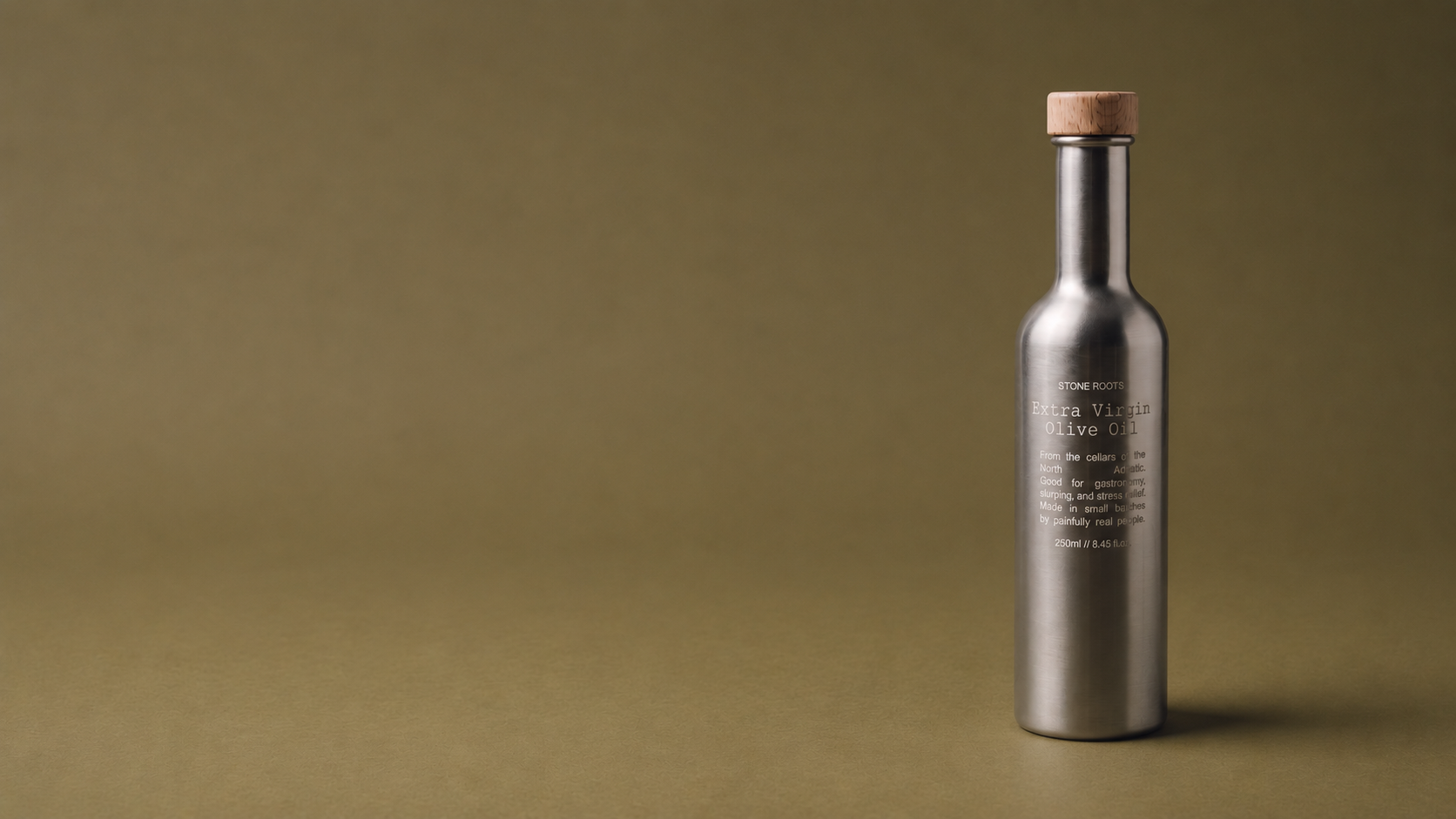 Stone Roots olive oil bottle on an olive background